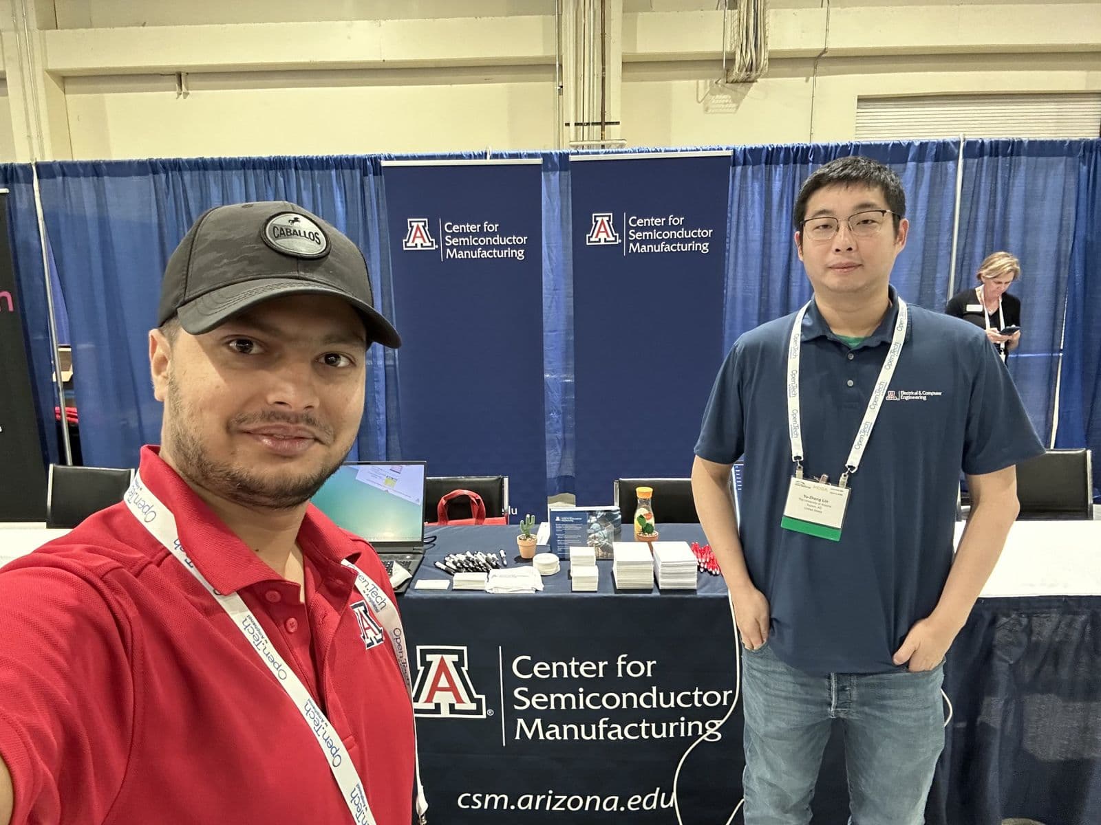 Selfie of Sujan Ghimire with a colleague at the University of Arizona Center for Semiconductor Manufacturing booth.